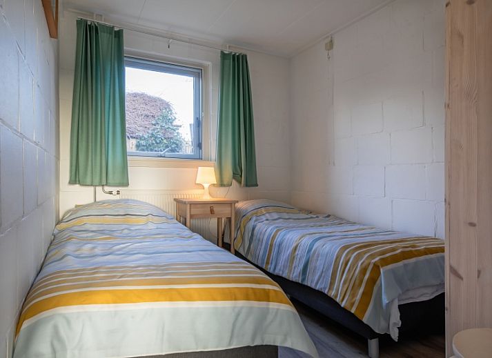 Gemuetliches Wohnzimmer im Ferienhaus Kikkertstraat 60, De Cocksdorp, Texel mit bequemer Sitzgelegenheit.