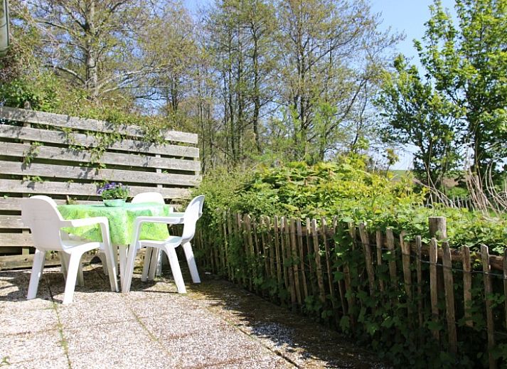 Gemuetliches Wohnzimmer im Ferienhaus Kikkertstraat 60, De Cocksdorp, Texel mit bequemer Sitzgelegenheit.