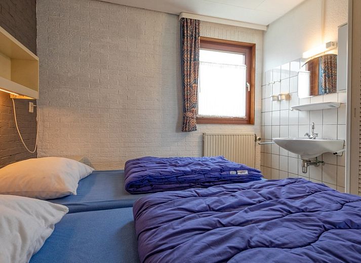 Gezellige woonkamer van Vakantiehuis Slufterhoek 056 in De Cocksdorp Texel met comfortabele zitruimte.
