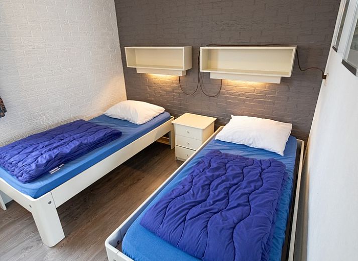 Gezellige woonkamer van Vakantiehuis Slufterhoek 056 in De Cocksdorp Texel met comfortabele zitruimte.