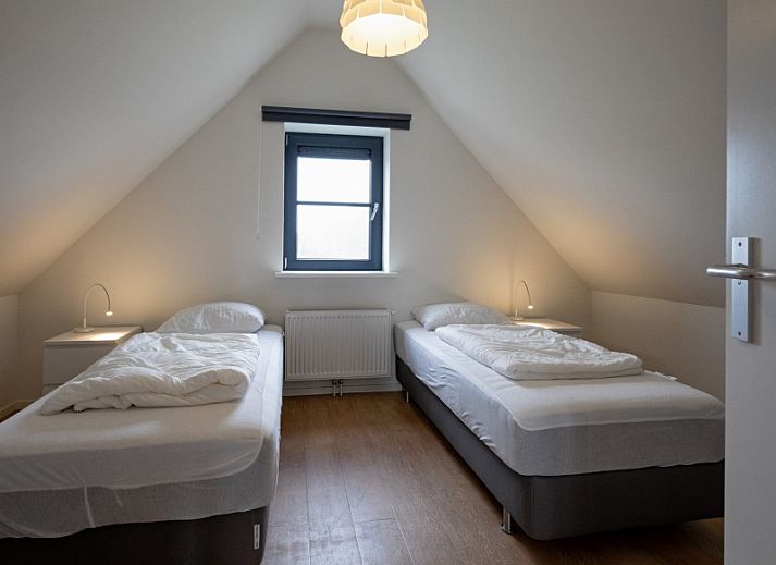 Cozy living room in Holiday home Slufteroord 240, Texel with comfortable seating area and modern furnishings.