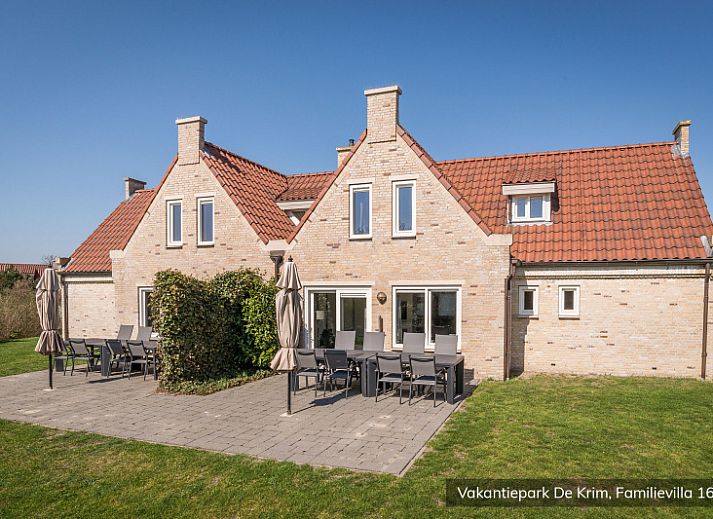 Cozy bedroom in Family Villa 16 persons, De Cocksdorp, Texel with comfortable beds.
