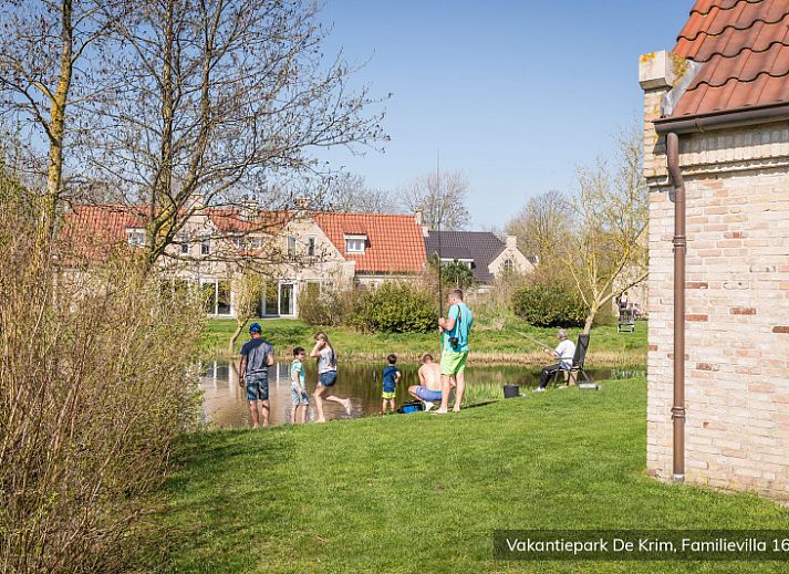 Cozy bedroom in Family Villa 16 persons, De Cocksdorp, Texel with comfortable beds.