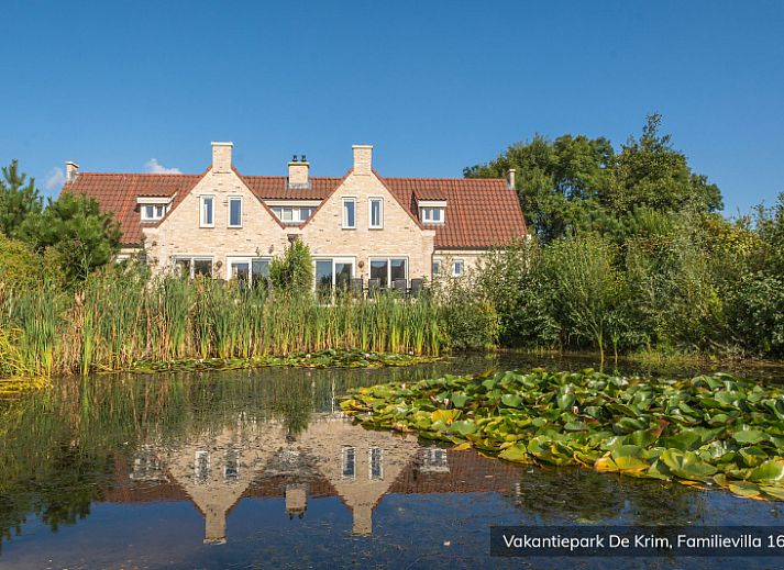 Cozy bedroom in Family Villa 16 persons, De Cocksdorp, Texel with comfortable beds.