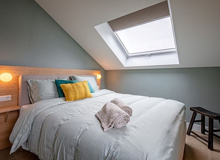 Gezellige woonkamer van Vakantiehuis Griend, De Cocksdorp, Texel met comfortabele bank.