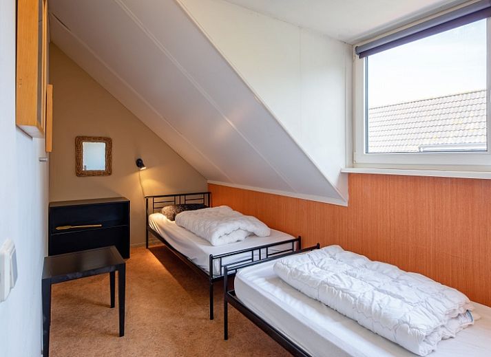 Stylish sitting room in Holiday home Slufterhoek 132, De Cocksdorp, Texel with modern furnishings and lots of natural light.