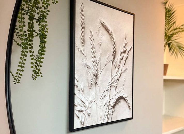 Gezellige woonkamer in Vakantiehuis in De Cocksdorp, Texel met comfortabele zitbanken.