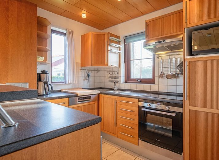 Villapark Residentie Texel nr. 463, een charmant vakantiehuis in De Cocksdorp, Texel, omgeven door groene natuur en rustgevende omgeving.