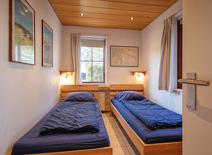 Gezellige woonkamer van Villapark Residentie Texel nr. 463 in De Cocksdorp, Texel. Comfortabele zithoek met veel lichtinval.