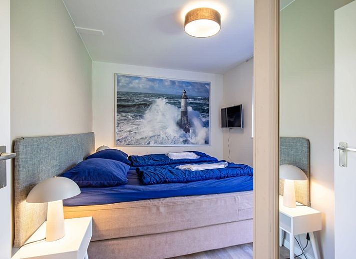 Vacation home D 690 in De Cocksdorp, Texel with sunny veranda and green surroundings, ideal for relaxation on the Wadden Islands.