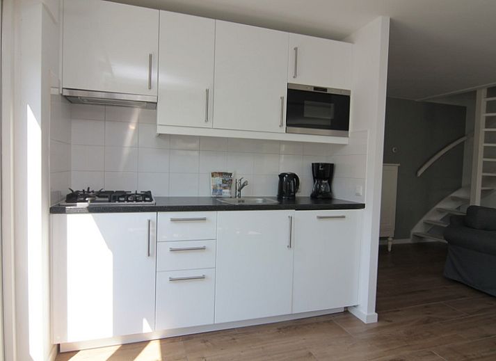 Vakantiehuis D 703 in De Cocksdorp, Texel, biedt een ruime tuin en rustieke charme op de Waddeneilanden.