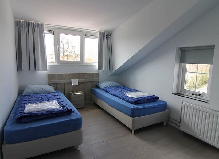 Vakantiehuis D 703 in De Cocksdorp, Texel, biedt een charmant terras en ruime tuin voor ontspanning op de Waddeneilanden.