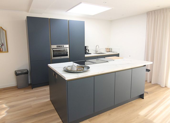 Enjoy the terrace of Holiday home D 449 in De Cocksdorp, Texel, surrounded by green nature on the Wadden Islands.