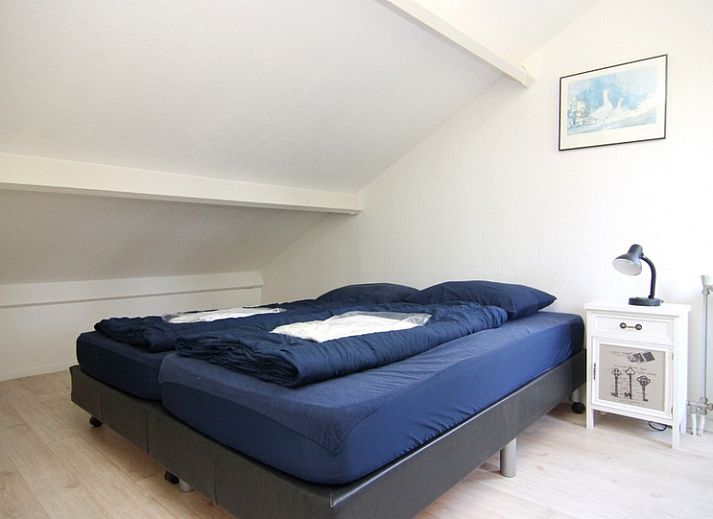 Geniet van de serene tuin en het terras van Vakantiehuis B 053 in De Cocksdorp, Texel, een ideale vakantiewoning op de Waddeneilanden.