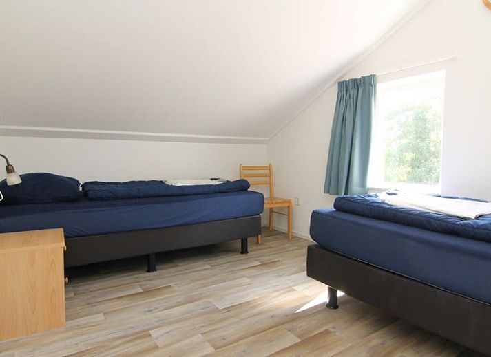 Vakantiehuis D 617 in De Cocksdorp, Texel met zonnig terras en groene tuin, ideaal voor een ontspannen verblijf op de Waddeneilanden.