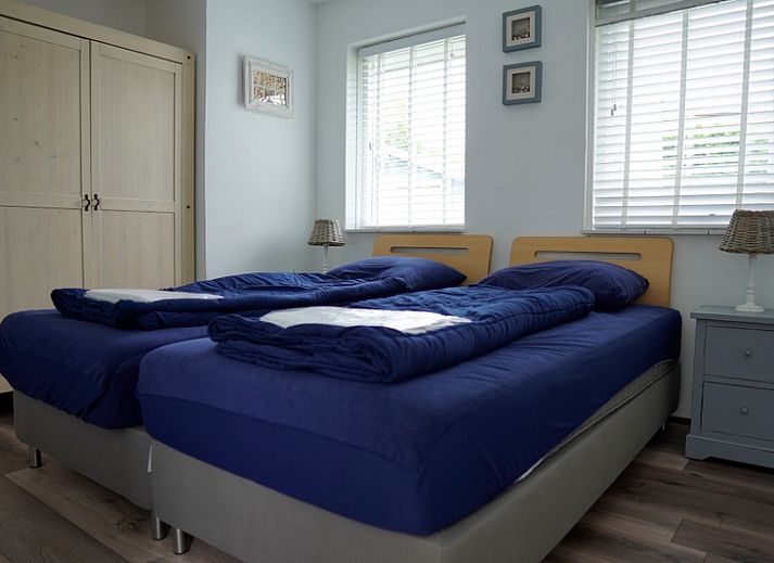 Vakantiehuis B 223 in De Cocksdorp, Texel, met zonnig terras en groene tuin, ideaal voor ontspannen verblijf op de Waddeneilanden.