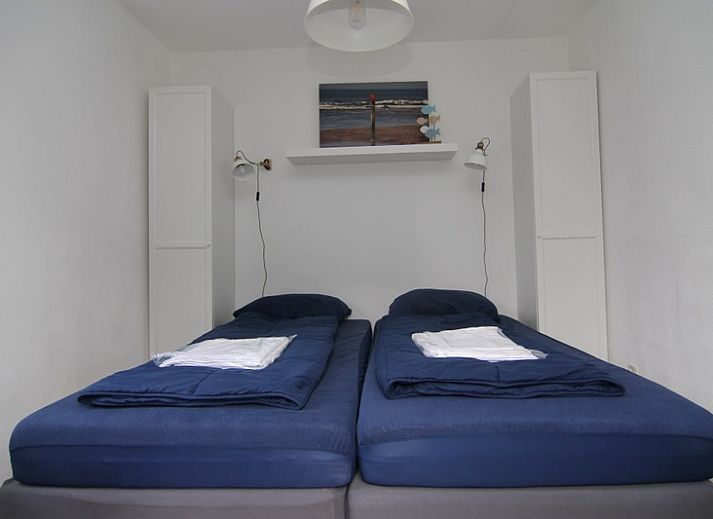 Vakantiehuis A 245 in De Cocksdorp, Texel, biedt een moderne buitenkant met ruime tuin, ideaal voor een ontspannen verblijf op de Waddeneilanden.