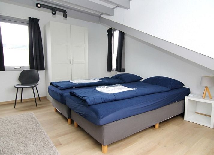 Vakantiehuis A 245 in De Cocksdorp, Texel, biedt een moderne buitenkant met ruime tuin, ideaal voor een ontspannen verblijf op de Waddeneilanden.