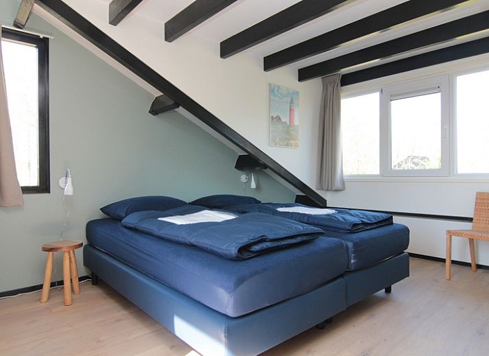 Vakantiehuis C 067 in De Cocksdorp, Texel biedt een uitnodigende voorgevel met moderne architectuur en omringende natuur.