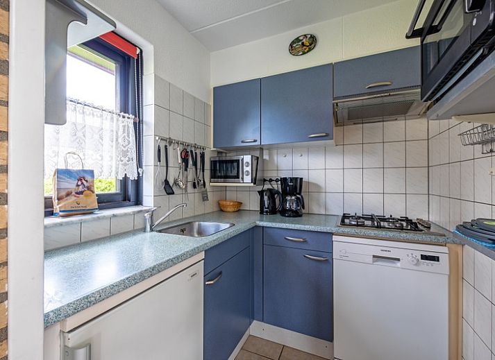 Vacation home A 309 in De Cocksdorp, Texel, offers a charming outdoor space with green garden and modern architecture on the Wadden Islands.