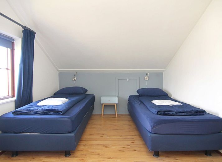 Vakantiehuis D 709 in De Cocksdorp, Texel, biedt een charmant verblijf met een zonnig terras en groene omgeving op de Waddeneilanden.