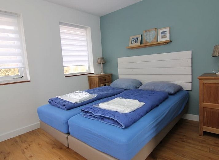 Vakantiehuis B 127 in De Cocksdorp, Texel biedt een charmant verblijf met moderne architectuur, ideaal voor een ontspannen vakantie op de Waddeneilanden.