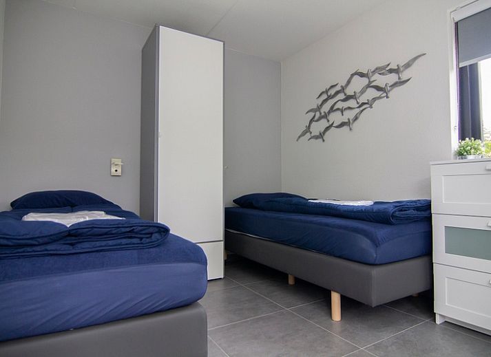 Vakantiehuis A 209 in De Cocksdorp, Texel, biedt een charmant verblijf op de Waddeneilanden met een rustige tuin en moderne architectuur.