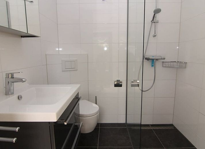 Vakantiehuis A 209 in De Cocksdorp, Texel, biedt een charmant verblijf op de Waddeneilanden met een rustige tuin en moderne architectuur.