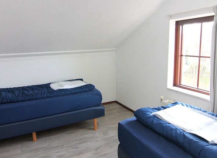 Vakantiehuis D 531 in De Cocksdorp, Texel, biedt een charmante buitenkant met ruime tuin, ideaal voor een ontspannen verblijf op de Waddeneilanden.