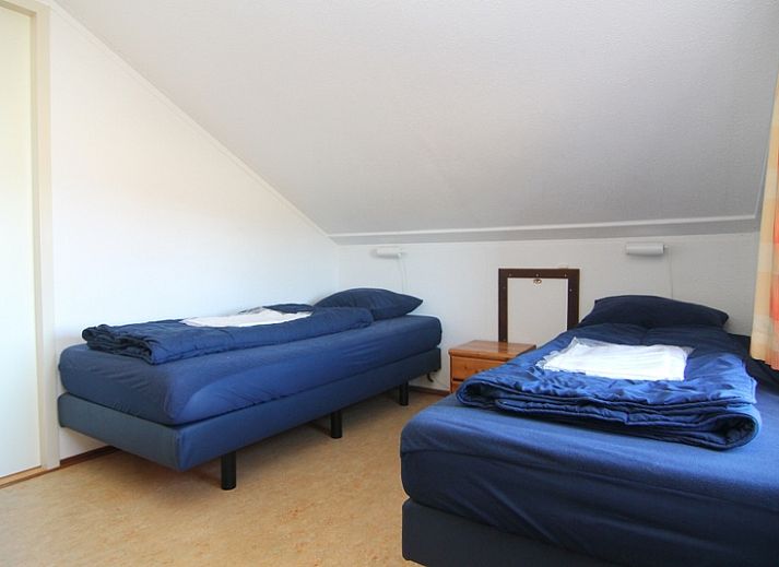 Vakantiehuis D 481 in De Cocksdorp, Texel, biedt een charmant terras en uitzicht op de natuurlijke omgeving van de Waddeneilanden.