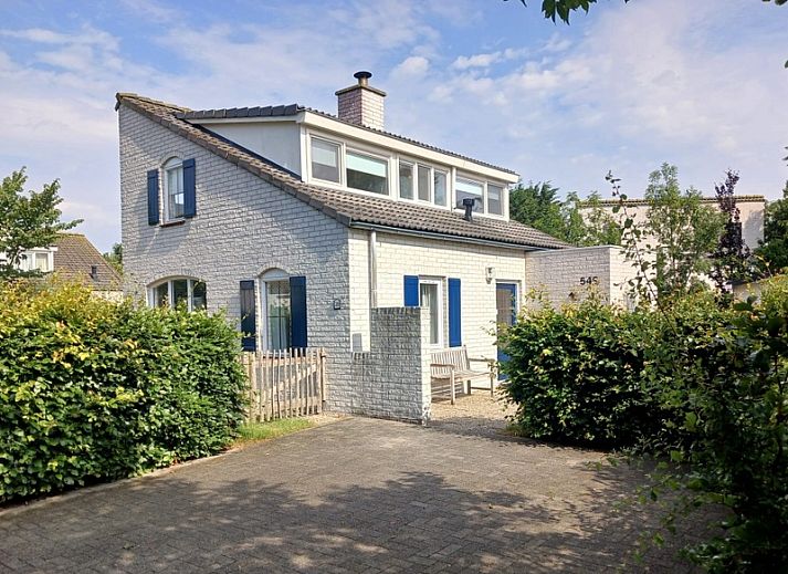 Vacation home F 549 in De Cocksdorp, Texel offers a charming exterior with sunny terrace, ideal for a relaxing stay on the Wadden Islands.