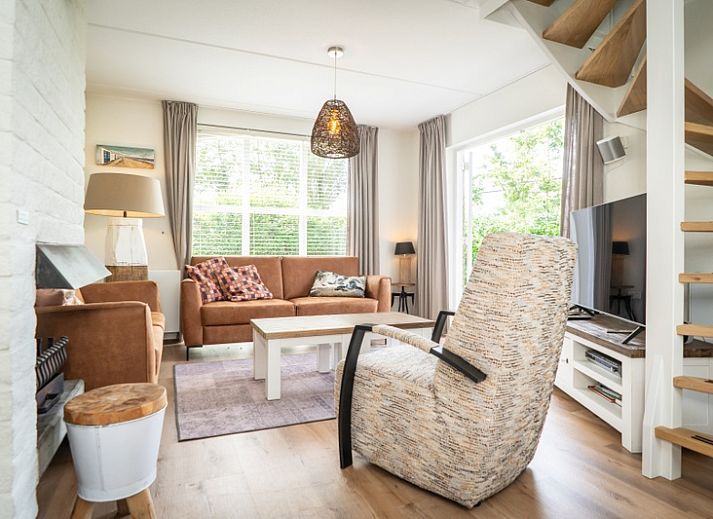 Vacation home F 549 in De Cocksdorp, Texel, offers a charming exterior with spacious garden and terrace, ideal for a relaxing stay on the Wadden Islands.