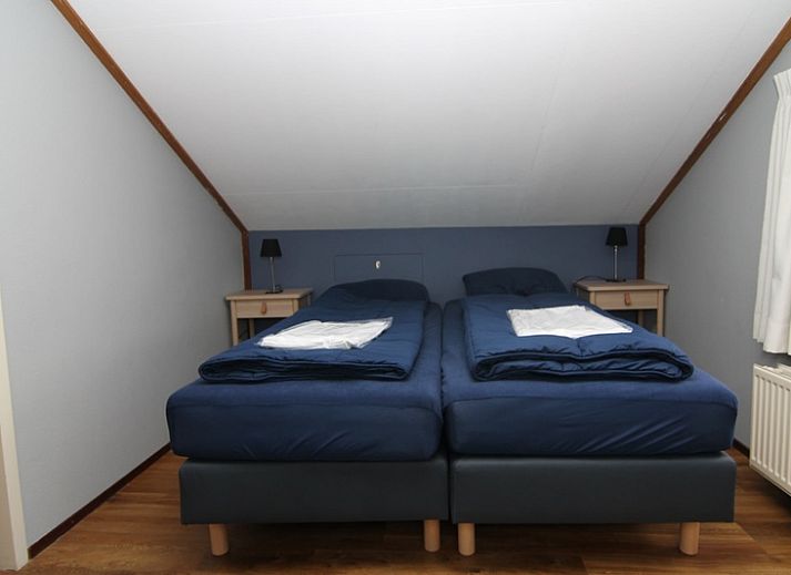 Vakantiehuis D 622 in De Cocksdorp, Texel, biedt een charmant verblijf met omheinde tuin en uitnodigend terras, ideaal voor een ontspannen vakantie.