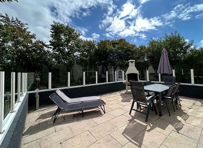 Vakantiehuis E 417 in De Cocksdorp, Texel biedt een charmante buitenkant met ruime tuin en rustieke omgeving op de Waddeneilanden.