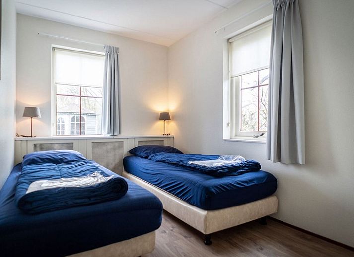 Vakantiehuis E 417 in De Cocksdorp, Texel, Waddeneilanden, biedt een charmant verblijf met ruime tuin en rustieke uitstraling.