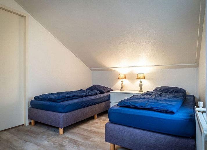 Vakantiehuis E 417 in De Cocksdorp, Texel, Waddeneilanden, biedt een charmant verblijf met ruime tuin en rustieke uitstraling.