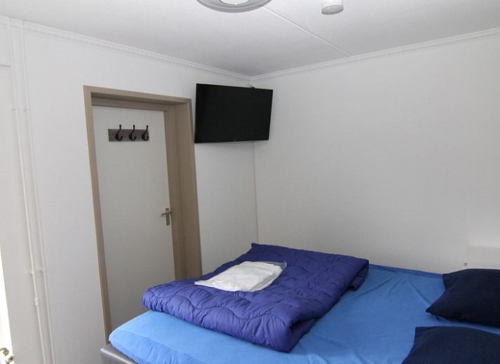 Vakantiehuis D 728 in De Cocksdorp op Texel biedt een charmant terras en serene omgeving voor een ontspannen verblijf op de Waddeneilanden.