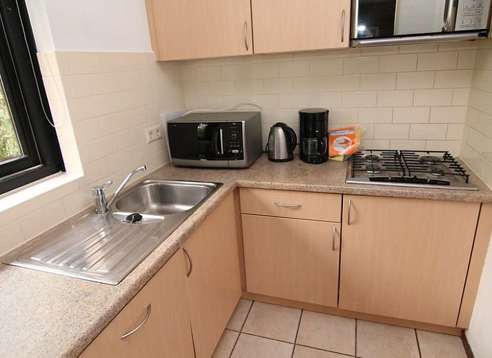 Vacation home A 275 in De Cocksdorp, Texel, offers a charming exterior with garden and modern architecture on the Wadden Islands.