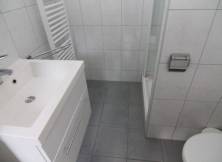 Vacation home A 275 in De Cocksdorp, Texel, offers a charming exterior with garden and modern architecture on the Wadden Islands.