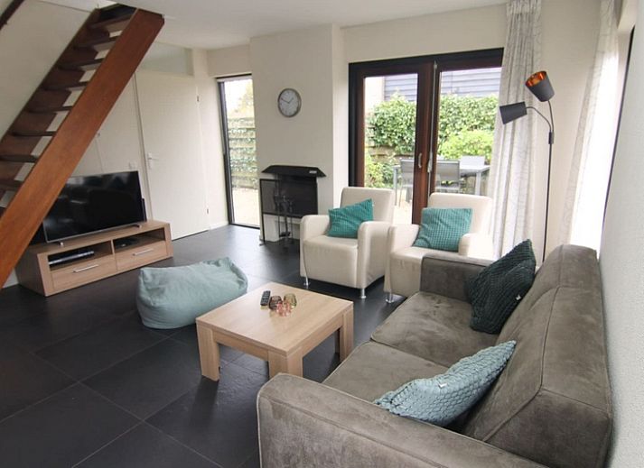 Vakantiehuis B 387 in De Cocksdorp, Texel, biedt een charmant verblijf met een zonnig terras en omringende natuur op de Waddeneilanden.