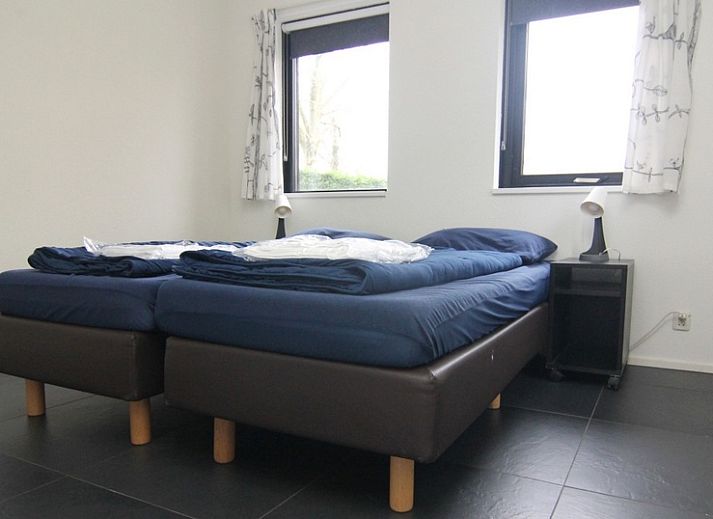 Vakantiehuis B 387 in De Cocksdorp, Texel, biedt een charmante buitenruimte met terras en groene omgeving op de Waddeneilanden.