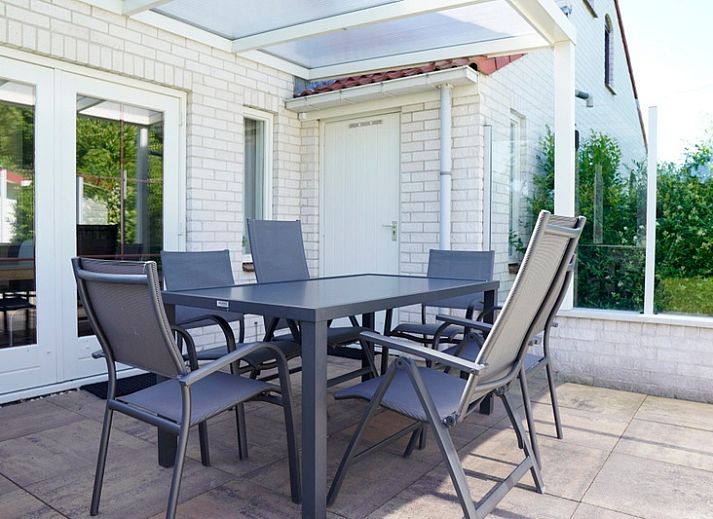 Vakantiehuis D 415 in De Cocksdorp, Texel, met zonnige tuin en moderne architectuur, ideaal voor een ontspannen verblijf op de Waddeneilanden.