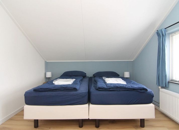 Vakantiehuis D 610 in De Cocksdorp, Texel, biedt een charmante buitenruimte met een omheinde tuin en groene omgeving op de Waddeneilanden.