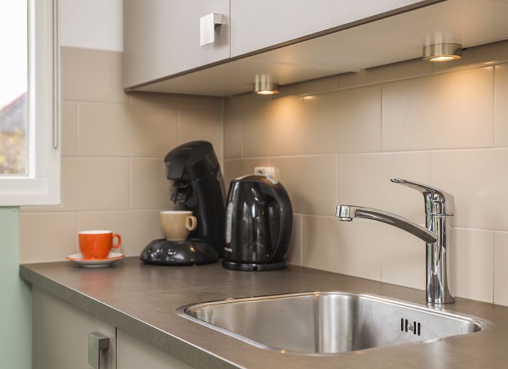 Knusse zithoek in Sluftervallei 6-persoons bungalow 6C, De Cocksdorp, Texel, ideaal voor ontspanning.