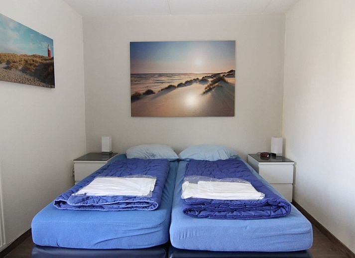 Vakantiehuis D 720 in De Cocksdorp, Texel, omgeven door groene natuur en rustieke charme, ideaal voor een ontspannen verblijf op de Waddeneilanden.