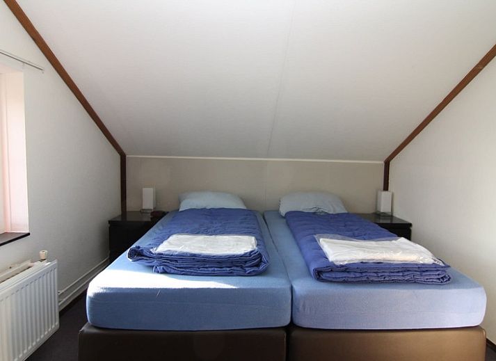 Vakantiehuis D 720 in De Cocksdorp, Texel, omgeven door groene natuur en rustieke charme, ideaal voor een ontspannen verblijf op de Waddeneilanden.