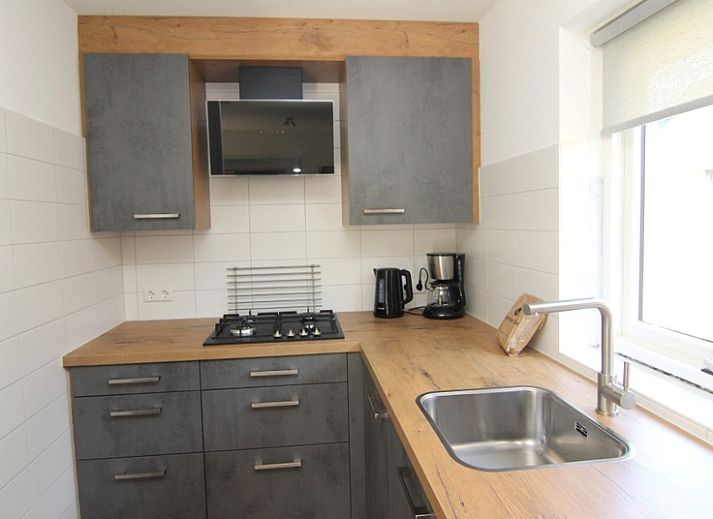 Vakantiehuis A 287 in De Cocksdorp, Texel biedt een charmant verblijf op de Waddeneilanden met een rustieke buitenkant en groene omgeving.