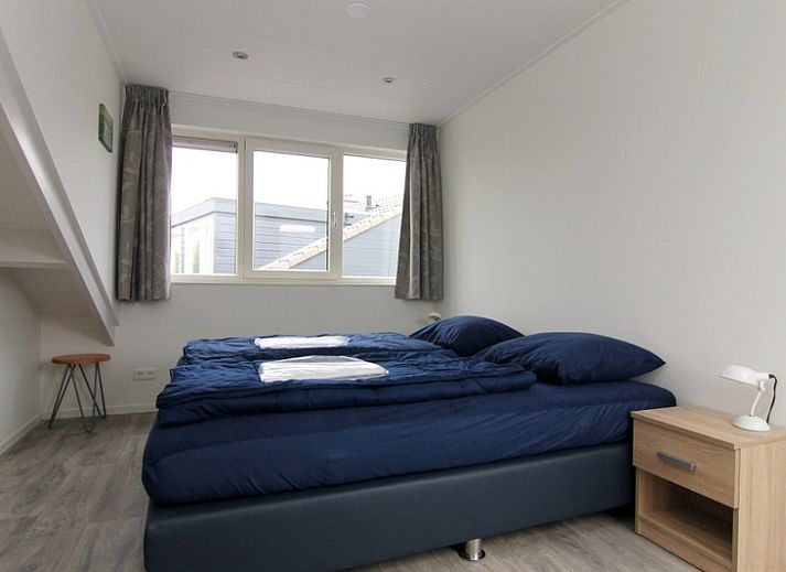 Vakantiehuis A 287 in De Cocksdorp, Texel biedt een charmant verblijf op de Waddeneilanden met een rustieke buitenkant en groene omgeving.