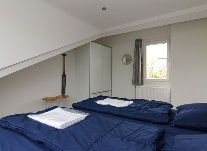 Vakantiehuis A 287 in De Cocksdorp, Texel met zonnig terras en groene tuin, ideaal voor een ontspannen verblijf op de Waddeneilanden.