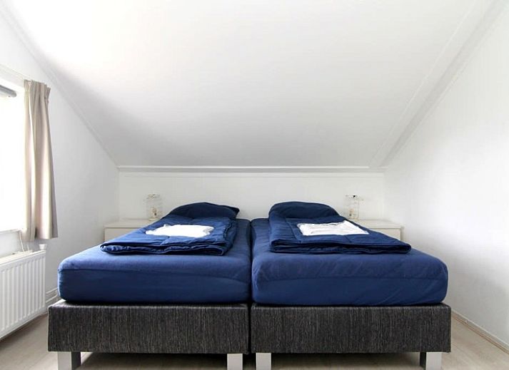 Vakantiehuis D 533 in De Cocksdorp, Texel biedt een rustige buitenomgeving met groene natuur en ruime parkeerplaats.